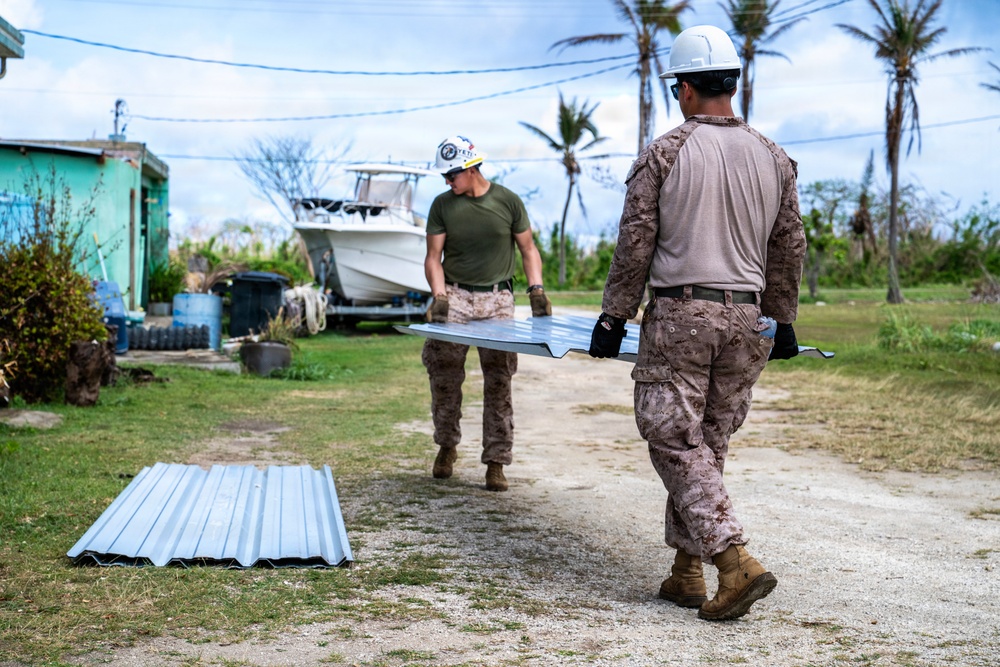 NMCB 1 Sailors and U.S. Marines conduct roof restoration operations in Tinian