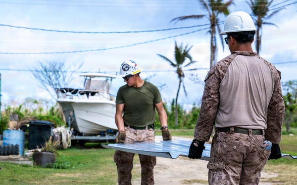 NMCB 1 Sailors and U.S. Marines conduct roof restoration operations in Tinian