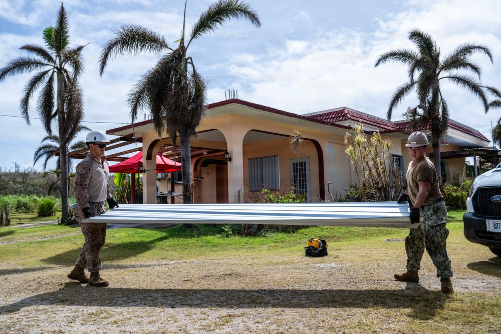 NMCB 1 Sailors and U.S. Marines conduct roof restoration operations in Tinian
