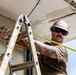 NMCB 1 Sailors and U.S. Marines conduct roof restoration operations in Tinian