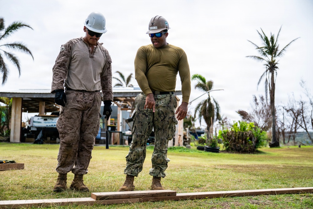 NMCB 1 Sailors and U.S. Marines conduct roof restoration operations in Tinian
