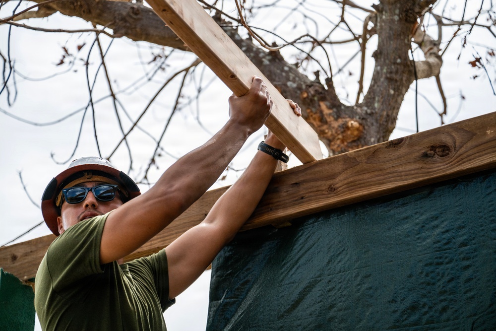NMCB 1 Sailors and U.S. Marines conduct roof restoration operations in Tinian