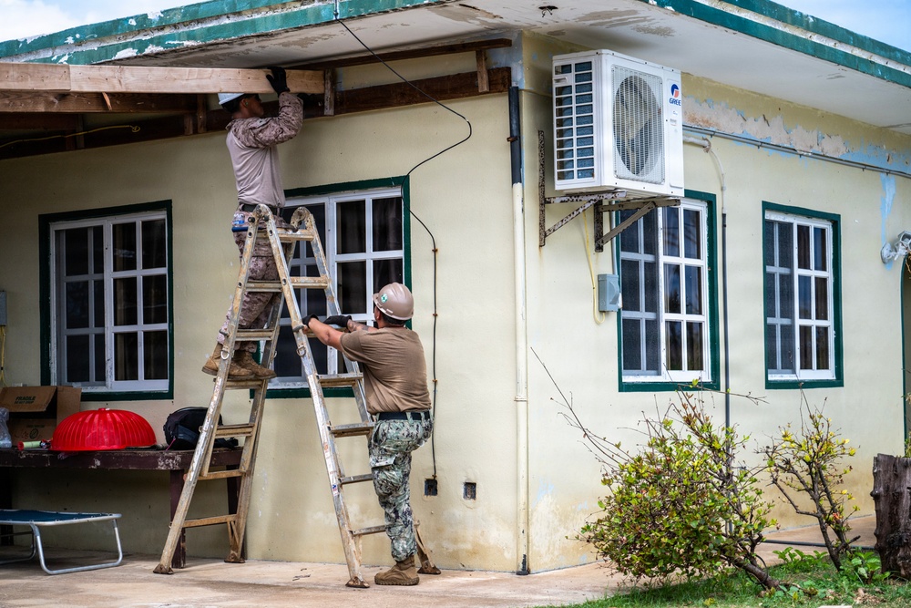 NMCB 1 Sailors and U.S. Marines conduct roof restoration operations in Tinian