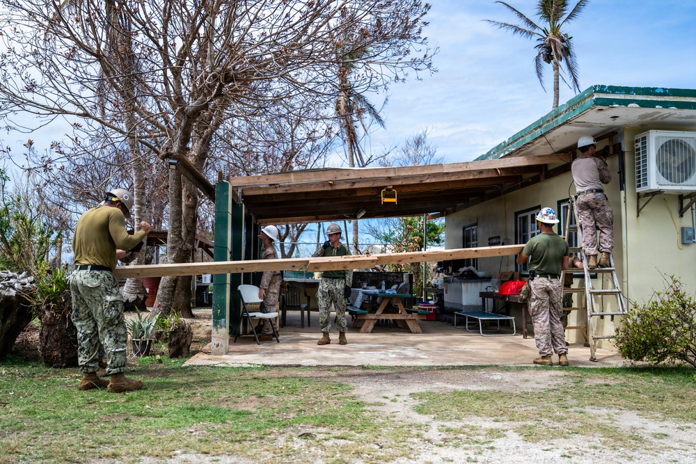 NMCB 1 Sailors and U.S. Marines conduct roof restoration operations in Tinian