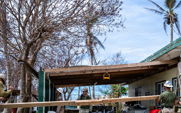 NMCB 1 Sailors and U.S. Marines conduct roof restoration operations in Tinian
