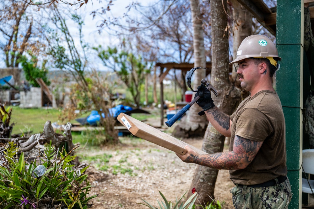 NMCB 1 Sailors and U.S. Marines conduct roof restoration operations in Tinian
