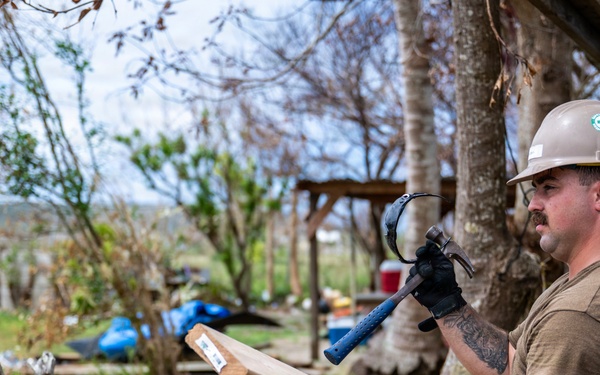 NMCB 1 Sailors and U.S. Marines conduct roof restoration operations in Tinian