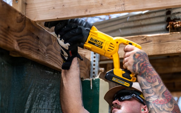 NMCB 1 Sailors and U.S. Marines conduct roof restoration operations in Tinian
