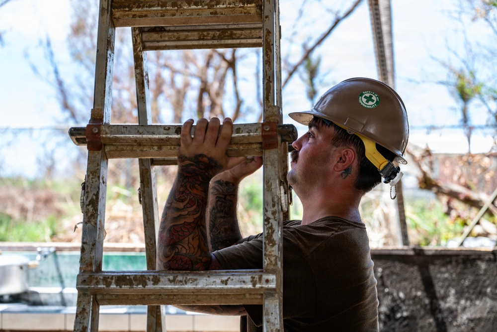 NMCB 1 Sailors and U.S. Marines conduct roof restoration operations in Tinian