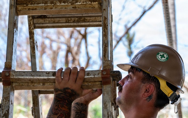 NMCB 1 Sailors and U.S. Marines conduct roof restoration operations in Tinian