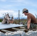 NMCB 1 Sailors and U.S. Marines conduct roof restoration operations in Tinian