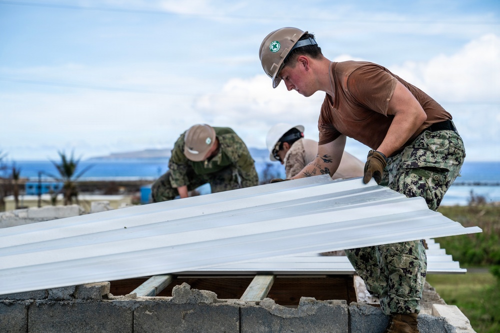 NMCB 1 Sailors and U.S. Marines conduct roof restoration operations in Tinian