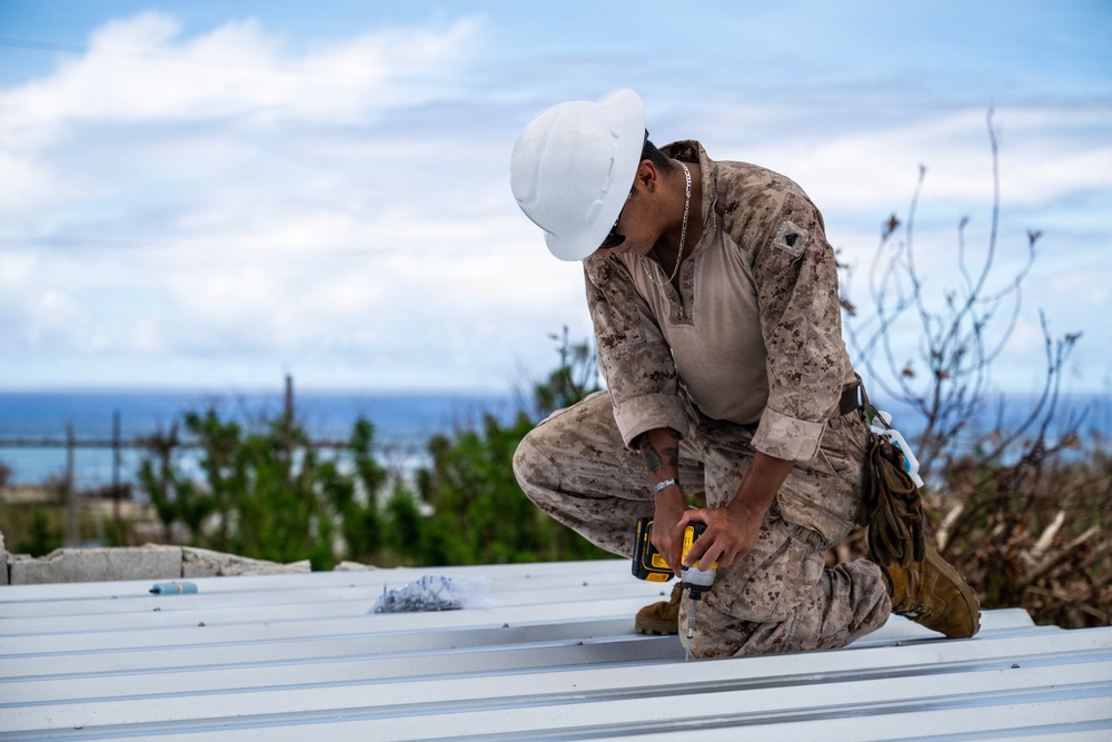 NMCB 1 Sailors and U.S. Marines conduct roof restoration operations in Tinian