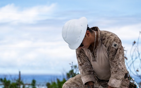 NMCB 1 Sailors and U.S. Marines conduct roof restoration operations in Tinian