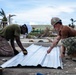NMCB 1 Sailors and U.S. Marines conduct roof restoration operations in Tinian