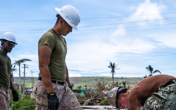 NMCB 1 Sailors and U.S. Marines conduct roof restoration operations in Tinian