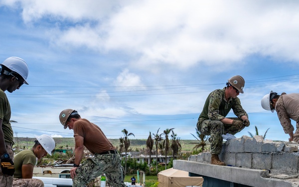 NMCB 1 Sailors and U.S. Marines conduct roof restoration operations in Tinian