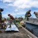 NMCB 1 Sailors and U.S. Marines conduct roof restoration operations in Tinian