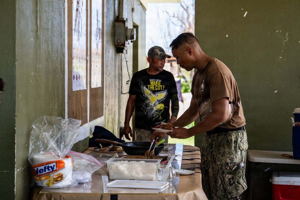 NMCB 1 Sailors and U.S. Marines conduct roof restoration operations in Tinian