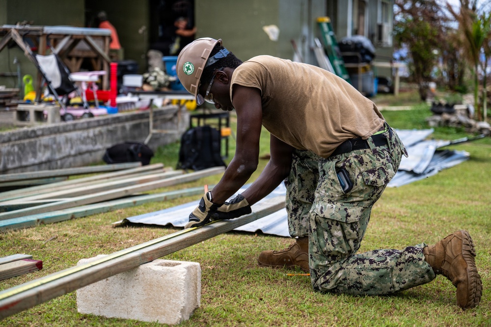 NMCB 1 Sailors and U.S. Marines conduct roof restoration operations in Tinian