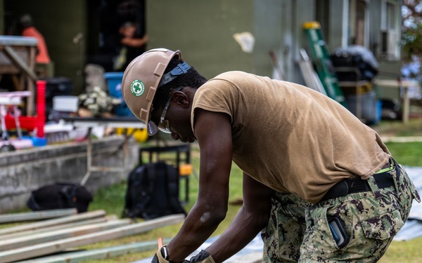 NMCB 1 Sailors and U.S. Marines conduct roof restoration operations in Tinian