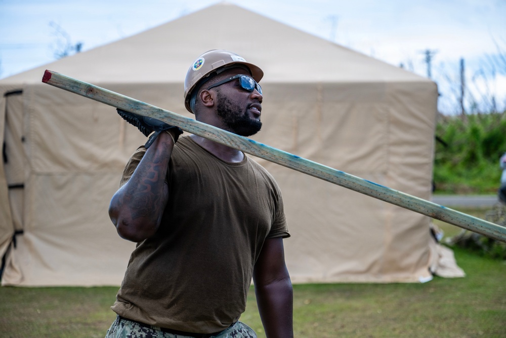 NMCB 1 Sailors and U.S. Marines conduct roof restoration operations in Tinian
