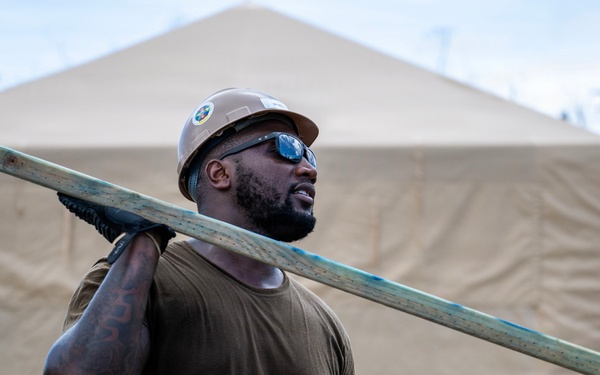 NMCB 1 Sailors and U.S. Marines conduct roof restoration operations in Tinian