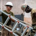 NMCB 1 Sailors and U.S. Marines conduct roof restoration operations in Tinian