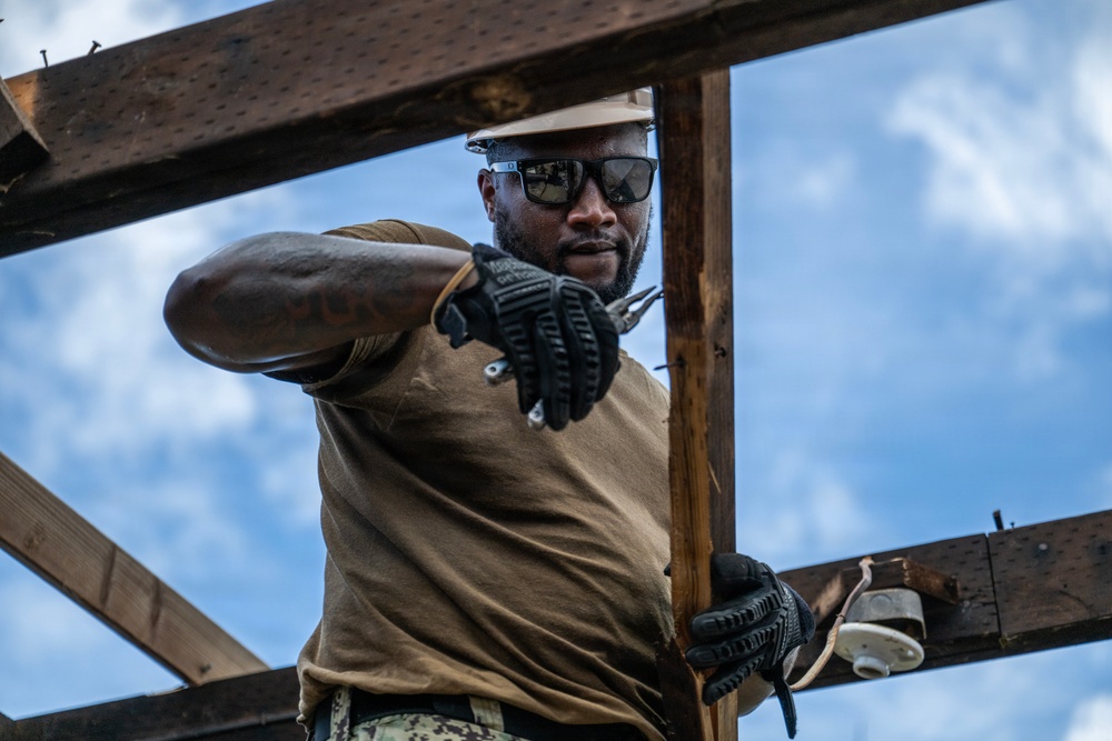 NMCB 1 Sailors and U.S. Marines conduct roof restoration operations in Tinian