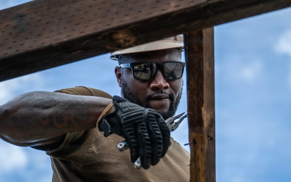 NMCB 1 Sailors and U.S. Marines conduct roof restoration operations in Tinian