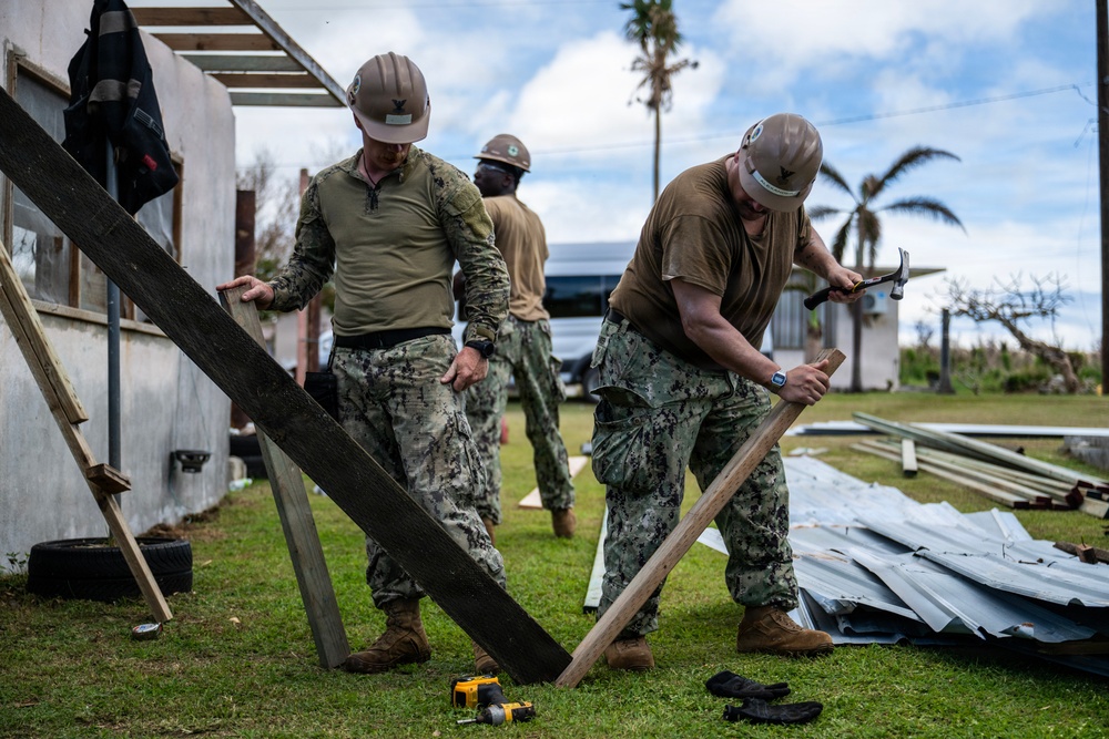 NMCB 1 Sailors and U.S. Marines conduct roof restoration operations in Tinian