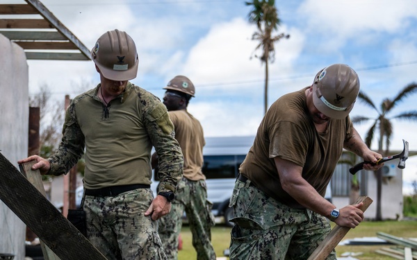 NMCB 1 Sailors and U.S. Marines conduct roof restoration operations in Tinian