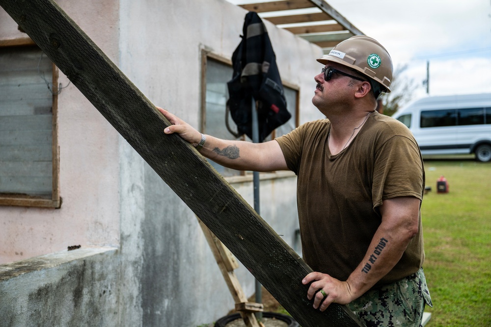 NMCB 1 Sailors and U.S. Marines conduct roof restoration operations in Tinian
