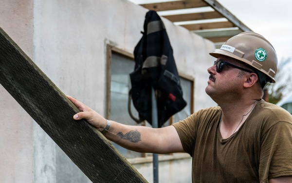 NMCB 1 Sailors and U.S. Marines conduct roof restoration operations in Tinian