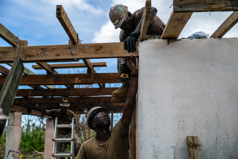 NMCB 1 Sailors and U.S. Marines conduct roof restoration operations in Tinian