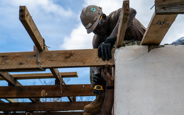 NMCB 1 Sailors and U.S. Marines conduct roof restoration operations in Tinian