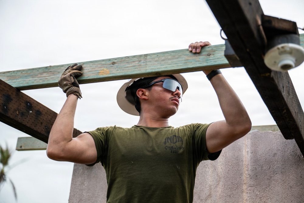 NMCB 1 Sailors and U.S. Marines conduct roof restoration operations in Tinian