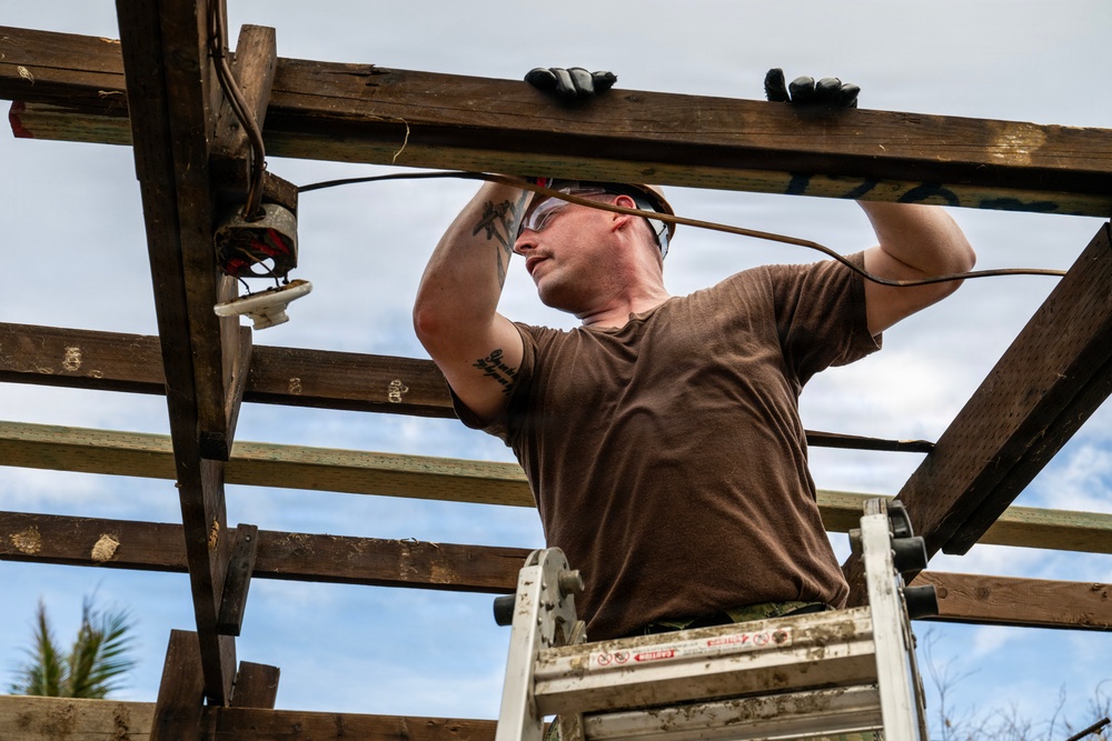 NMCB 1 Sailors and U.S. Marines conduct roof restoration operations in Tinian