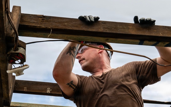 NMCB 1 Sailors and U.S. Marines conduct roof restoration operations in Tinian