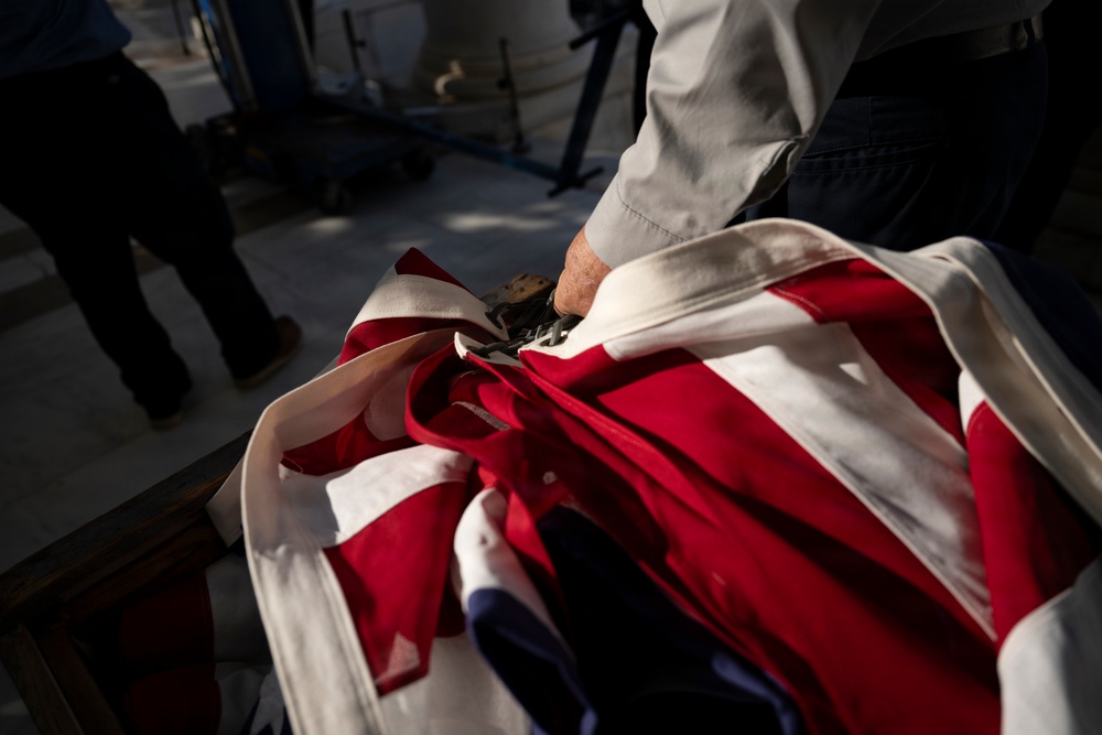 U.S. Flags are Hung in the Memorial Amphitheater in Preparation for the 2026 National Memorial Day Observance