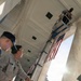 U.S. Flags are Hung in the Memorial Amphitheater in Preparation for the 2026 National Memorial Day Observance
