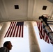 U.S. Flags are Hung in the Memorial Amphitheater in Preparation for the 2026 National Memorial Day Observance