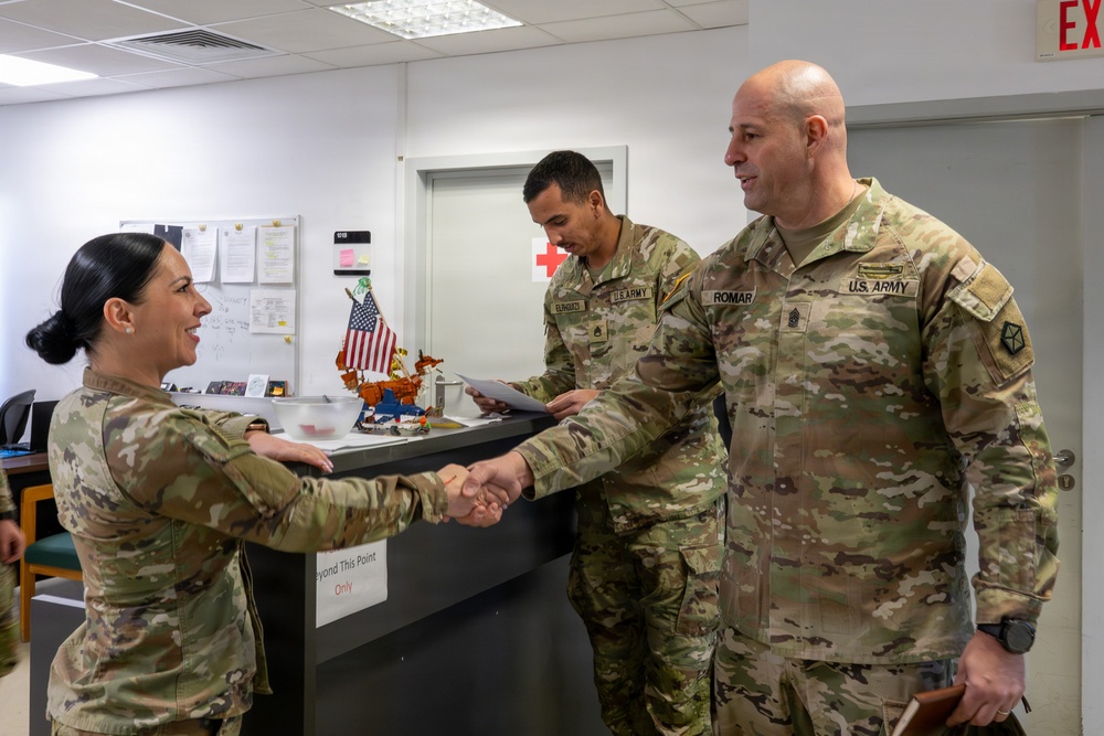 Capt Nicoleta Panaite greets USAG Poland CSM Alejandro Romar in the USAG Black Sea Joint Aid Station