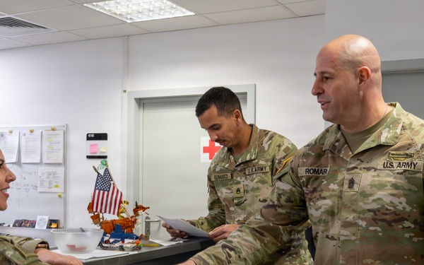 Capt Nicoleta Panaite greets USAG Poland CSM Alejandro Romar in the USAG Black Sea Joint Aid Station