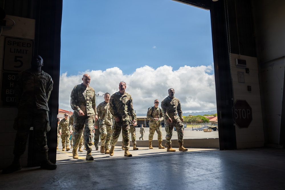 515th AMOW and 735th AMS Airmen Brief CMSAF Wolfe on Global Mobility Operations