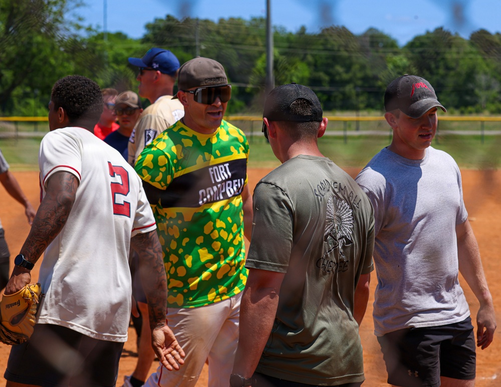 U.S. Army soldiers play softball during Week of the Eagles