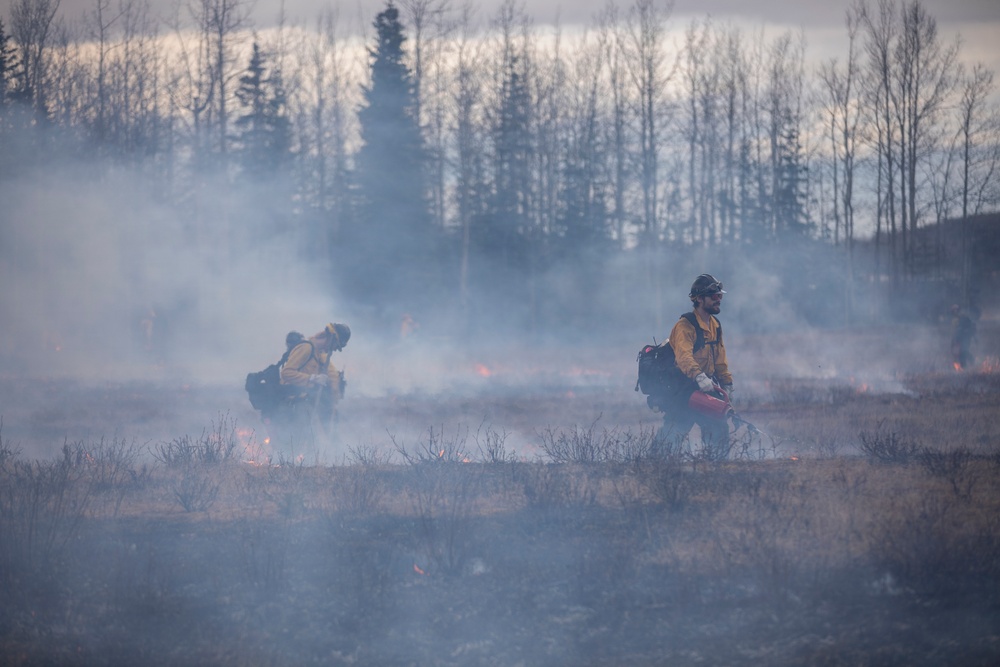 Alaska Air National Guard, Air Force, and State of Alaska Division of Forestry and Fire Protection firefighters team up during controlled burns