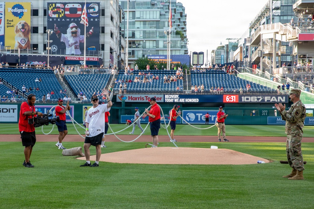 Staff Sgt. Andrew Wolfe Throws First Pitch at Washington Nationals National Guard Appreciation Game