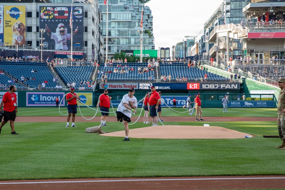 Staff Sgt. Andrew Wolfe Throws First Pitch at Washington Nationals National Guard Appreciation Game