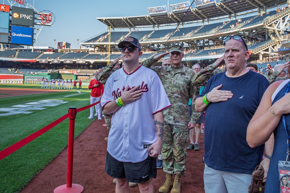 Staff Sgt. Andrew Wolfe Throws First Pitch at Washington Nationals National Guard Appreciation Game